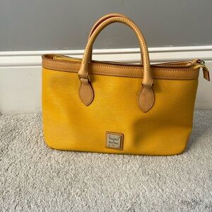 Dooney and Burke yellow/gold purse.